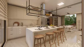 Vista de uma cozinha moderna com ilha e sala de jantar em Lajeado.