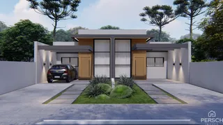 Fachada moderna de uma residência com jardim e garagem.
