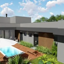 Foto da fachada de uma residência em Lajeado, Brasil com vegetação ao fundo.