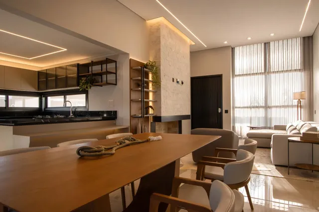 Foto de um ambiente aberto que combina cozinha e sala de jantar em um apartamento moderno.