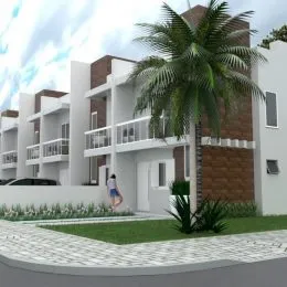 Fachada de um prédio residencial moderno em Lajeado, Brasil, com varandas e palmeira.