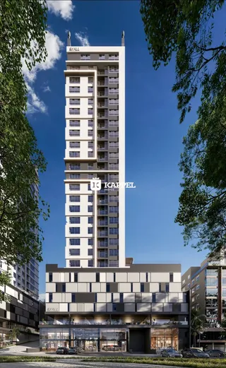 Fachada de um edifício residencial alto em Lajeado, Brasil, com vários andares e varandas.