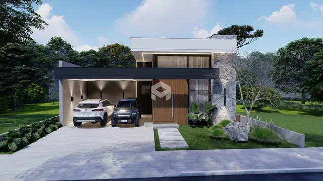 Fachada moderna de uma residência em Lajeado, Brasil, com jardim e entrada pavimentada.