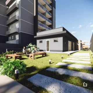 Vista externa de um apartamento em Lajeado, Brasil, com jardim e área de lazer.