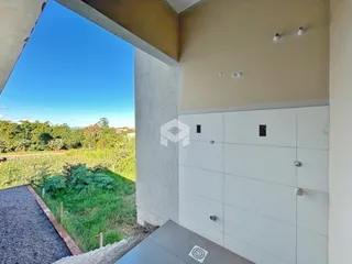 Vista externa de uma propriedade em Lajeado, Brasil com vegetação ao fundo.