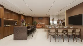 Vista de uma sala de jantar moderna com mesa grande e armários de madeira.