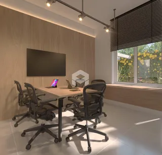 Ambiente de escritório com mesa e cadeiras em um imóvel.