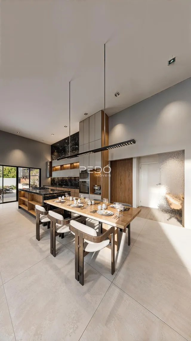 Sala de jantar moderna com mesa de madeira e armários em um imóvel.