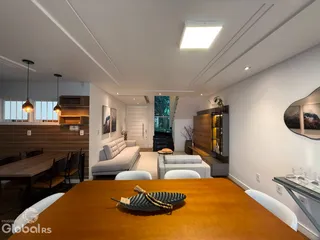 Sala de estar e jantar com decoração moderna em um imóvel no Brasil.