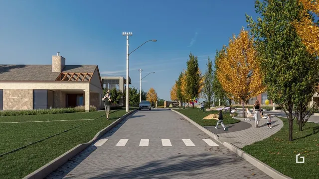 Vista externa de uma rua arborizada com uma residência moderna em Lajeado.