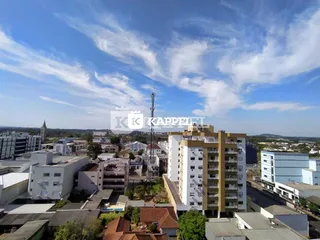 Vista aérea de um bairro residencial em Lajeado, Brasil, mostrando diversos edifícios.