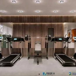 Foto interna de uma área de ginástica com equipamentos de musculação.