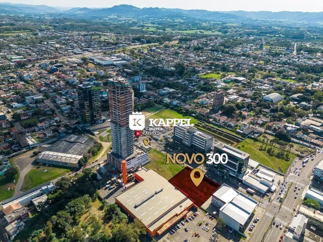 Vista aérea de uma área urbana em Lajeado, mostrando edifícios e paisagens.