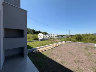 Vista da fachada de uma construção com terreno ao redor em Lajeado, Brasil.