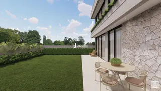 Fachada de uma residência com jardim verde.