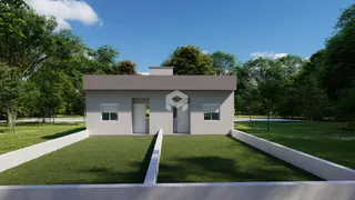 Foto da fachada de uma residência moderna em Lajeado, Brasil, com jardim gramado.