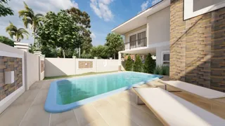 Vista externa de uma piscina e área de lazer de uma residência em Lajeado.