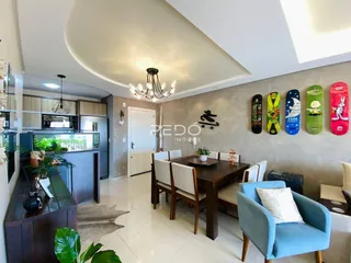 Sala de estar e jantar com decoração moderna em um imóvel no Brasil.