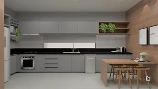 Imagem de uma cozinha moderna com armários cinzas e bancadas escuras.
