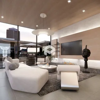 Sala de estar moderna com um sofá branco e televisão de tela plana.
