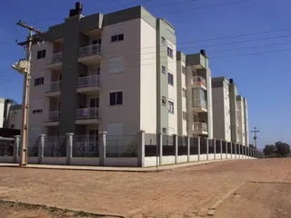 Fachada de um prédio residencial em Lajeado, Brasil, com vários andares e varandas.
