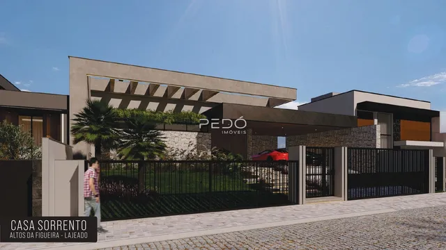 Fachada moderna de uma residência em Lajeado, Brasil, com cerca e paisagismo.