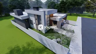 Fachada moderna de uma residência em Lajeado, Brasil, com paisagismo verde.