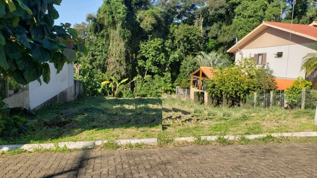 Vista externa de um terreno com grama e vegetação densa em Lajeado, Brasil.
