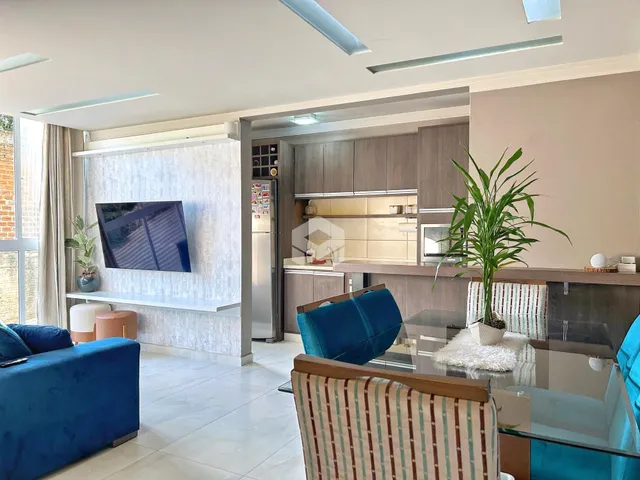 Sala de estar moderna com cozinha integrada e decoração contemporânea.