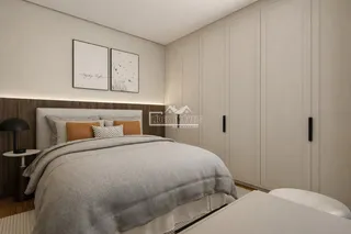 Quarto com armários embutidos e decoração moderna.