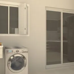 Máquina de lavar roupa branca em uma área de serviço.