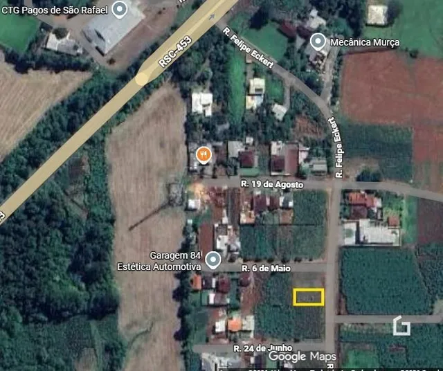 Vista aérea de uma propriedade em Lajeado, Brasil, mostrando ruas e áreas verdes.