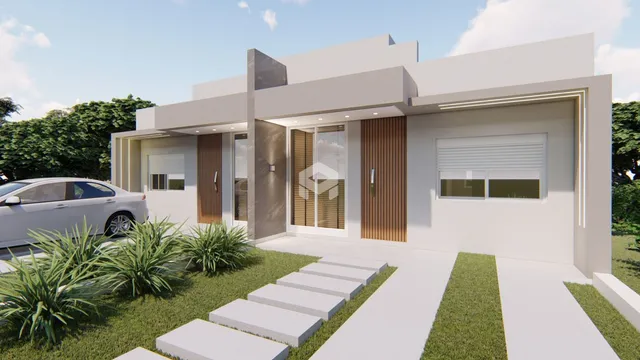 Fachada moderna de uma residência em Lajeado, Brasil, com jardim frontal.