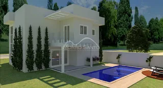 Fachada de uma casa moderna branca com piscina em Lajeado.