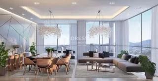 Ambiente moderno com sala de jantar e estar em um imóvel.