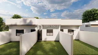 Fachada moderna de uma residência em Lajeado, Brasil, com jardim frontal.