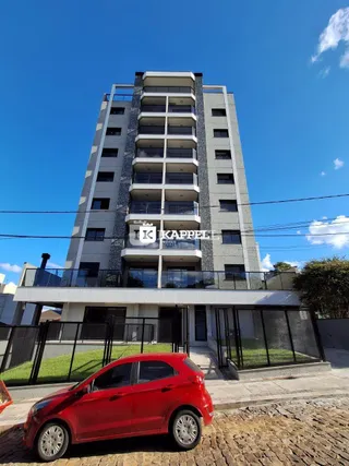 Fachada de um prédio residencial moderno em Lajeado, Brasil, com vários andares e varandas.