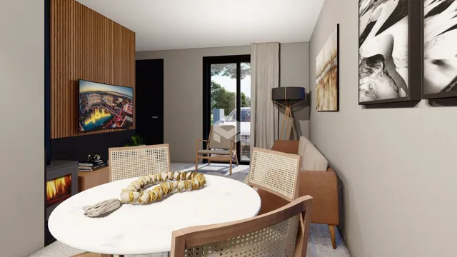 Ambiente interno de uma sala de estar com mesa redonda e decoração moderna.