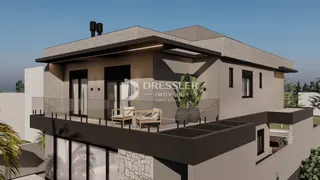 Fachada moderna de uma residência com varanda em Lajeado, Brasil.