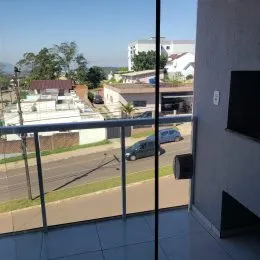 Vista externa da propriedade em Lajeado, com paisagem ao fundo.