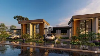 Fachada moderna de uma casa em Lajeado, Brasil, com paisagismo e área molhada na frente.