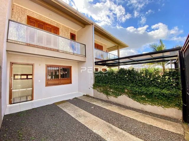 Fachada de um imóvel residencial em Lajeado, Brasil, com varanda e jardim.