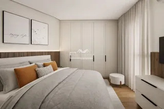 Quarto moderno com cabeceira e armários embutidos em um ambiente claro.