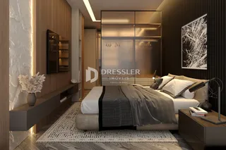 Quarto moderno com cabeceira e armário de madeira.
