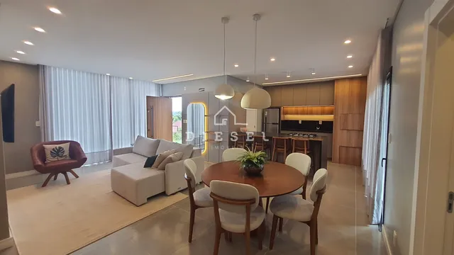 Sala de estar e jantar de um apartamento moderno em Lajeado.