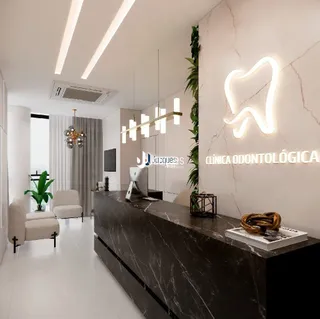 Interior de uma clínica odontológica moderna com paredes brancas e iluminação clara.