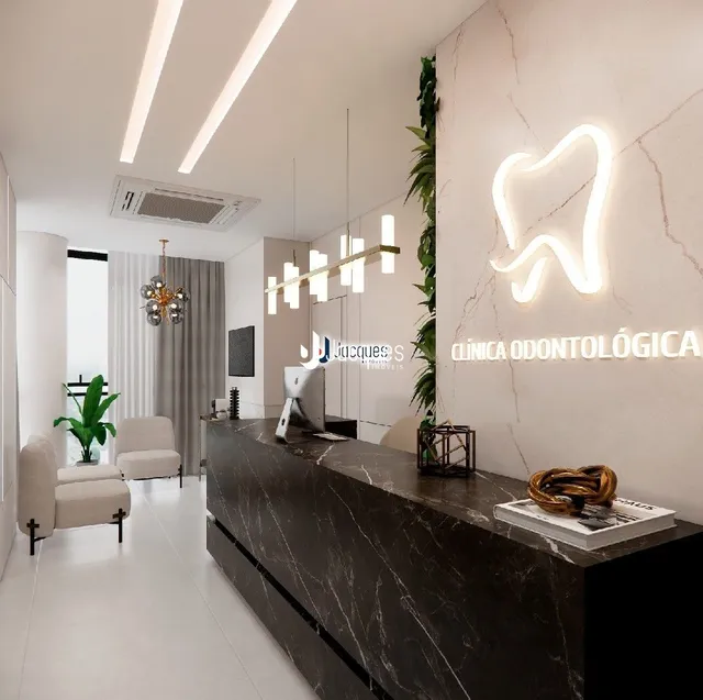 Interior de uma clínica odontológica moderna com paredes brancas e iluminação clara.