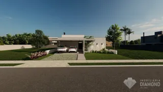 Fachada de uma residência em Lajeado, Brasil, com jardim frontal e entrada de garagem.