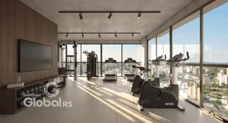 Interior de uma sala ampla com equipamentos de ginástica e grandes janelas.