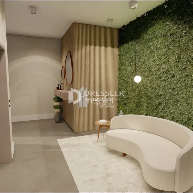 Sala de estar moderna com parede verde e sofá branco.